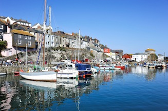 Fishing boats in Mevagissey harbour on a sunny day