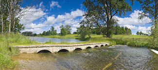 Low arched bridge over the River Windrush