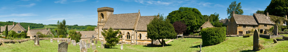 Snowshill, with the church, cottages and a war memorial clustered around the village green